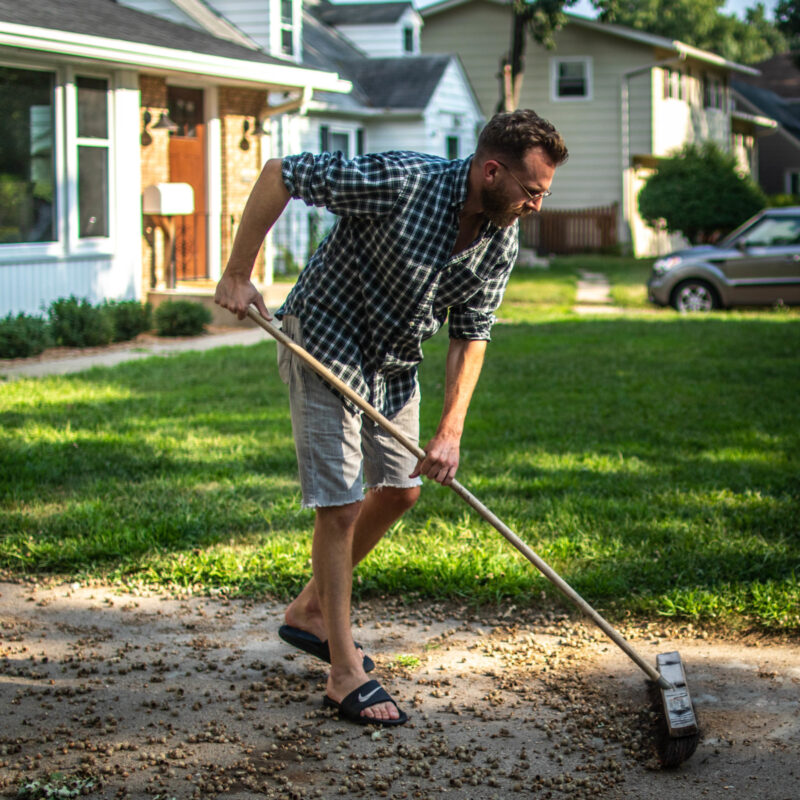Justin Sweeping Acorns in Minneapolis