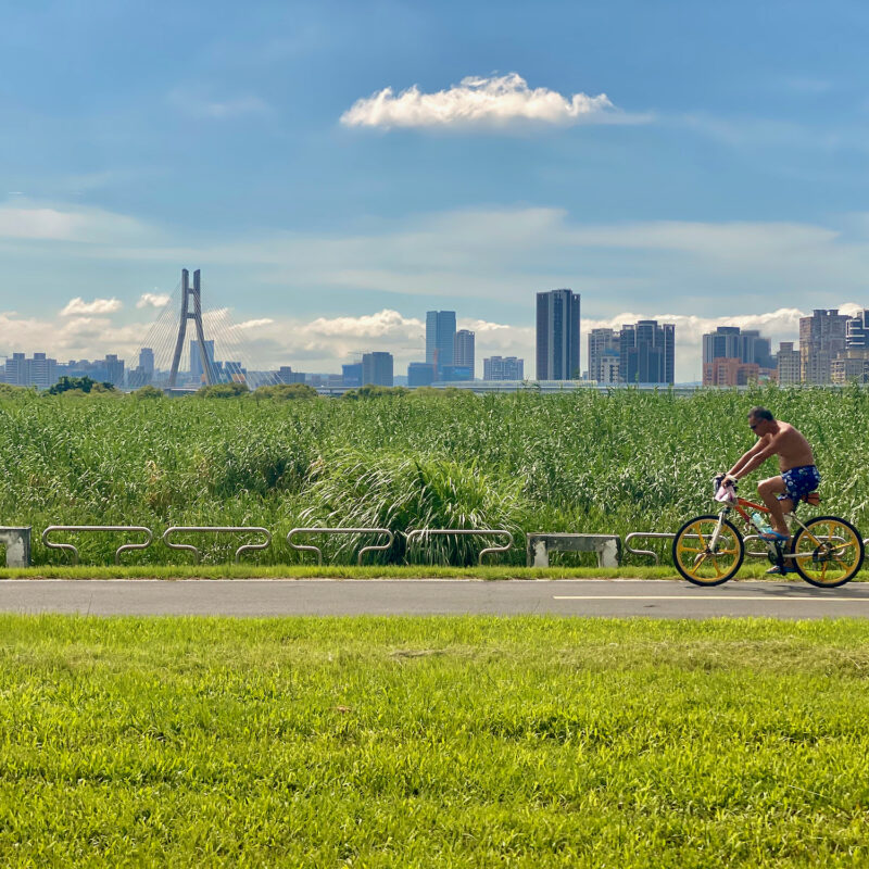 Man Riding Bike in Heat