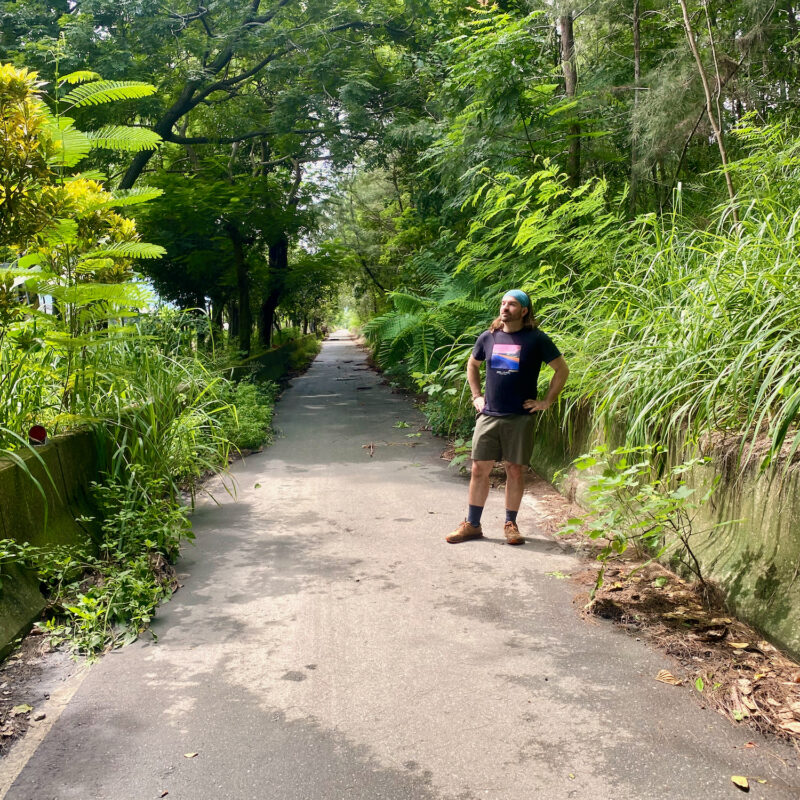Posing in a Verdant Alleyway
