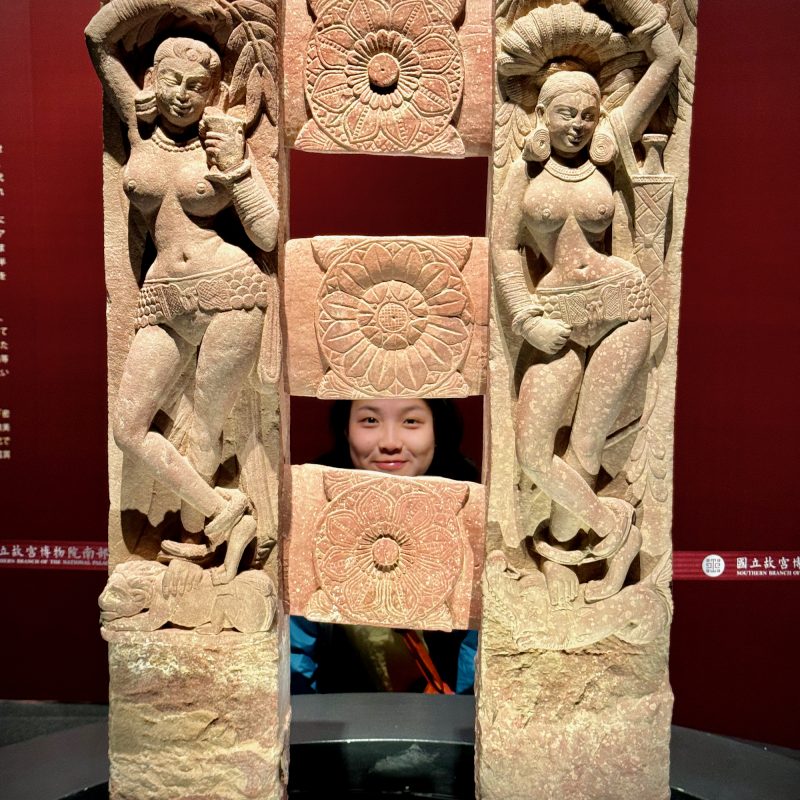 Ellen Between Ancient Statues