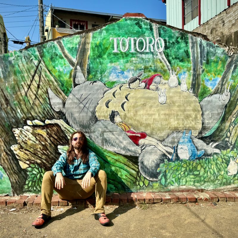 Posing With a Totoro Mural